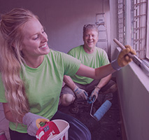 Rotary volunteers painting a room