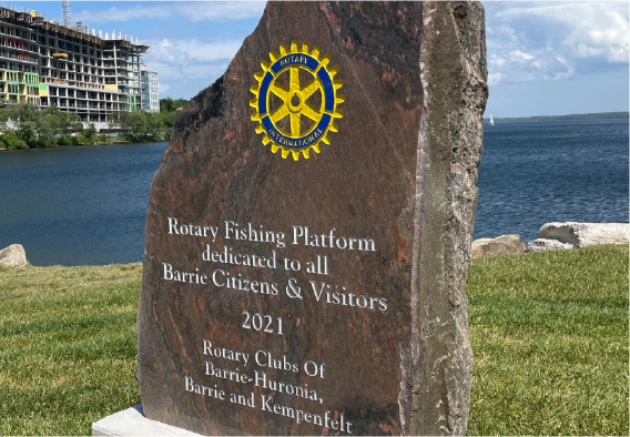 Rotary Fishing Platform stone plaque by the waterfront