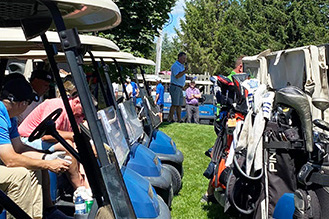 Photo of people in golf carts from a Rotary Club golf event
