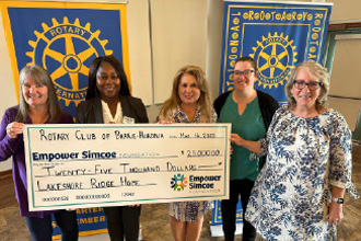 Rotary Club group photo with Empower Simcoe cheque