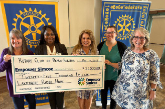 Rotary Club Empower Simcoe team photo with cheque
