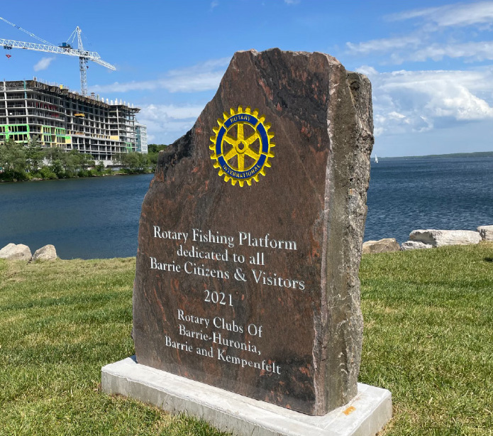 Rotary Fishing Platform stone plaque by the waterfront
